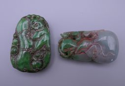 Two carved jade pendants. The largest 5.5 cm high.