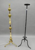 An onyx mounted standard lamp and a candle stand. Each approximately 136 cm high.