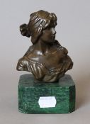 An Art Nouveau style bronze bust of a girl. 14.5 cm high.