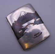 A sterling silver signed Japanese cigarette case depicting Mount Fuji. 6.5 cm wide.