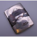 A sterling silver signed Japanese cigarette case depicting Mount Fuji. 6.5 cm wide.