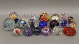 A quantity of various glass paperweights