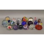 A quantity of various glass paperweights