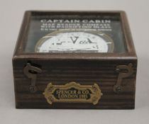 A boxed compass. 10.5 cm wide.