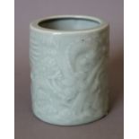 A Chinese celadon porcelain brush pot. 12 cm high.