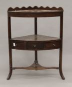 A 19th century mahogany corner washstand. 59 cm wide.