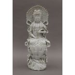 A 19th century Chinese blanc de chine model of Buddha, the reverse with impressed seal mark. 39.