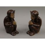 A pair of Chinese pottery monkeys. 16 cm high.