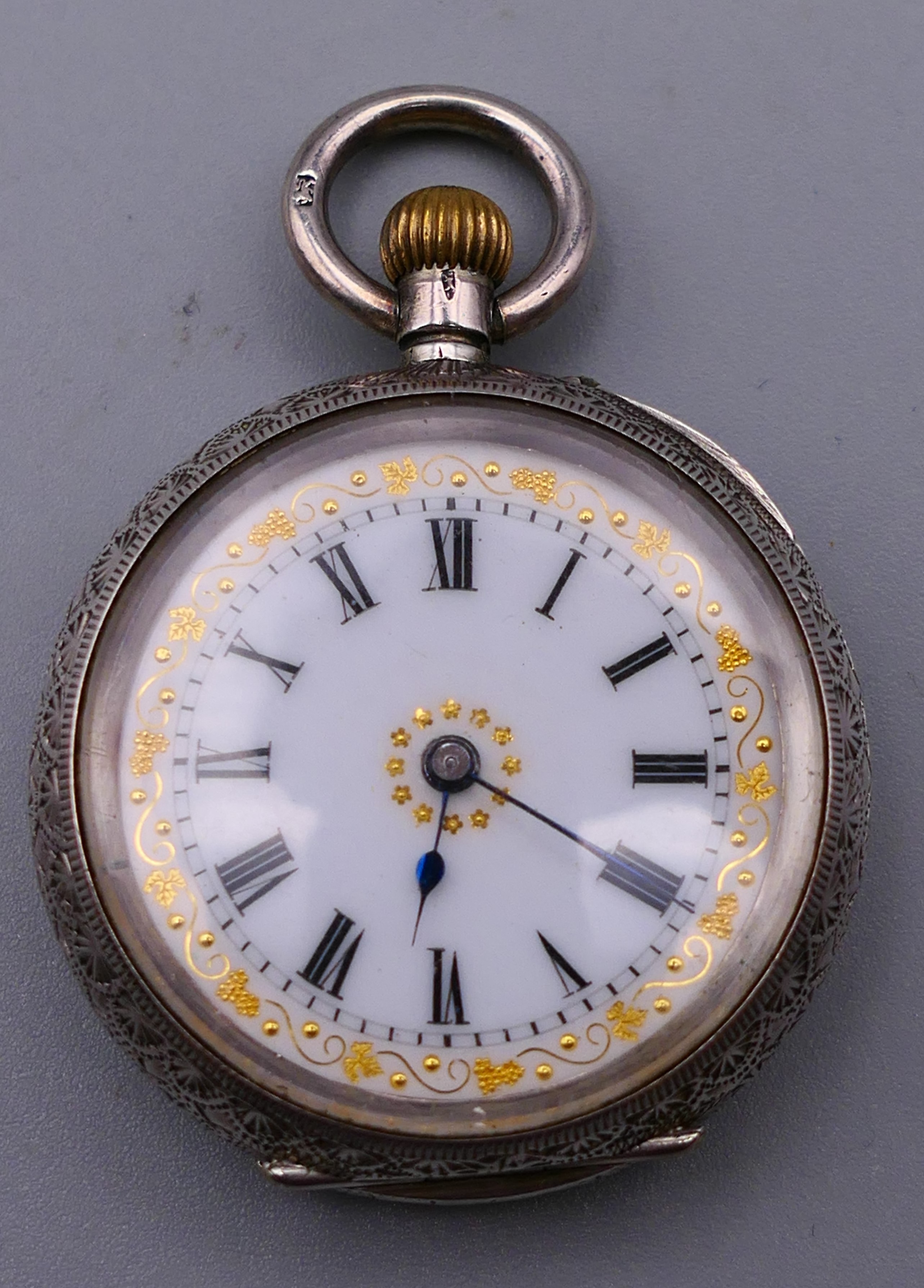 A 935 silver pocket watch. 3.25 cm diameter.