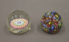 Two Italian millefiori paperweights. The largest 5.5 cm high.