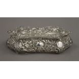 An embossed silver box. 14 cm wide. 104.2 grammes.