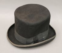 A Dorfman Pacific 'Mad Hatter' wool top hat. Approximate size 7 1/2.