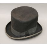 A Dorfman Pacific 'Mad Hatter' wool top hat. Approximate size 7 1/2.