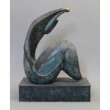 An abstract patinated bronze sculpture. 39.5 cm high.