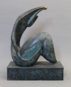 An abstract patinated bronze sculpture. 39.5 cm high.