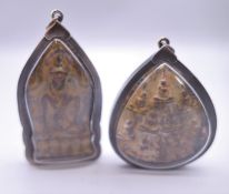 Two Tibetan icon pendants. The largest 7 cm high.