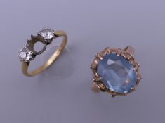 An 18 ct gold diamond set ring (lacking one stone) and an unmarked 9 ct gold ring.