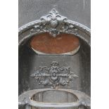 A cast iron fireplace.