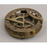 A brass sundial compass. 11 cm diameter.