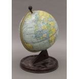 A Chad Valley tin globe. 26.5 cm high.