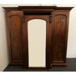 A Victorian mahogany breakfront triple wardrobe. 198.5 cm high x 216.5 cm wide.