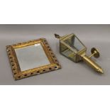 A Victorian gilt framed mirror and a brass carriage lamp surmounted with an eagle.