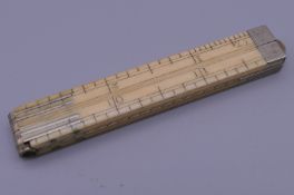 A 19th century ivory 1 foot folding rule.