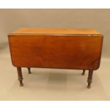 A Victorian mahogany drop leaf table. 96 cm wide.