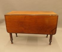 A Victorian mahogany drop leaf table. 96 cm wide.