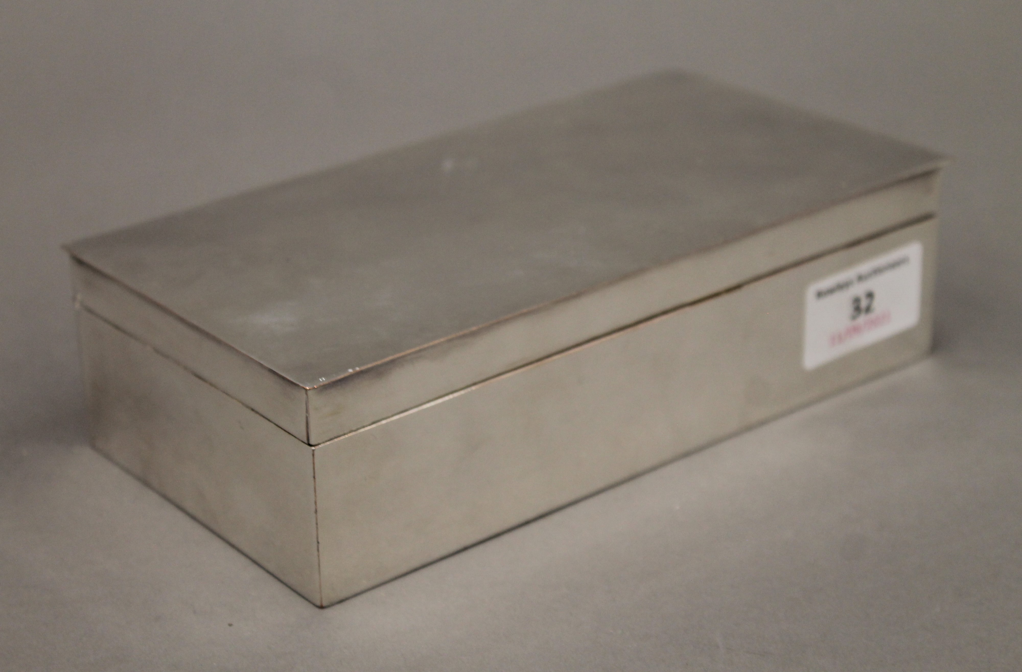 A silver plated cigarette box. 18 cm wide. - Image 2 of 4