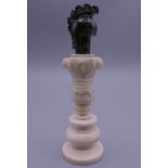 A 19th century ivory and marble chess piece. 10 cm high.