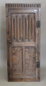 An early 20th century oak single door linen fold cupboard. 155 cm high x 66.5 cm wide.