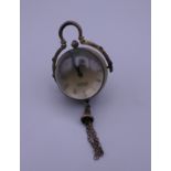 A ball watch. 9 cm high including tassel.