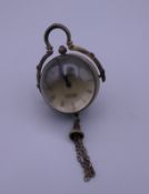 A ball watch. 9 cm high including tassel.