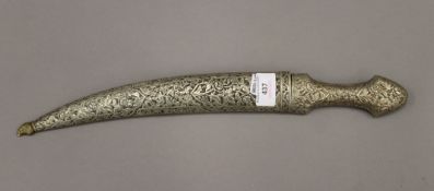 A 19th century Persian dagger with gold decoration. 43 cm long.