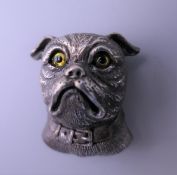 A silver dog's head form brooch. 3 cm high.