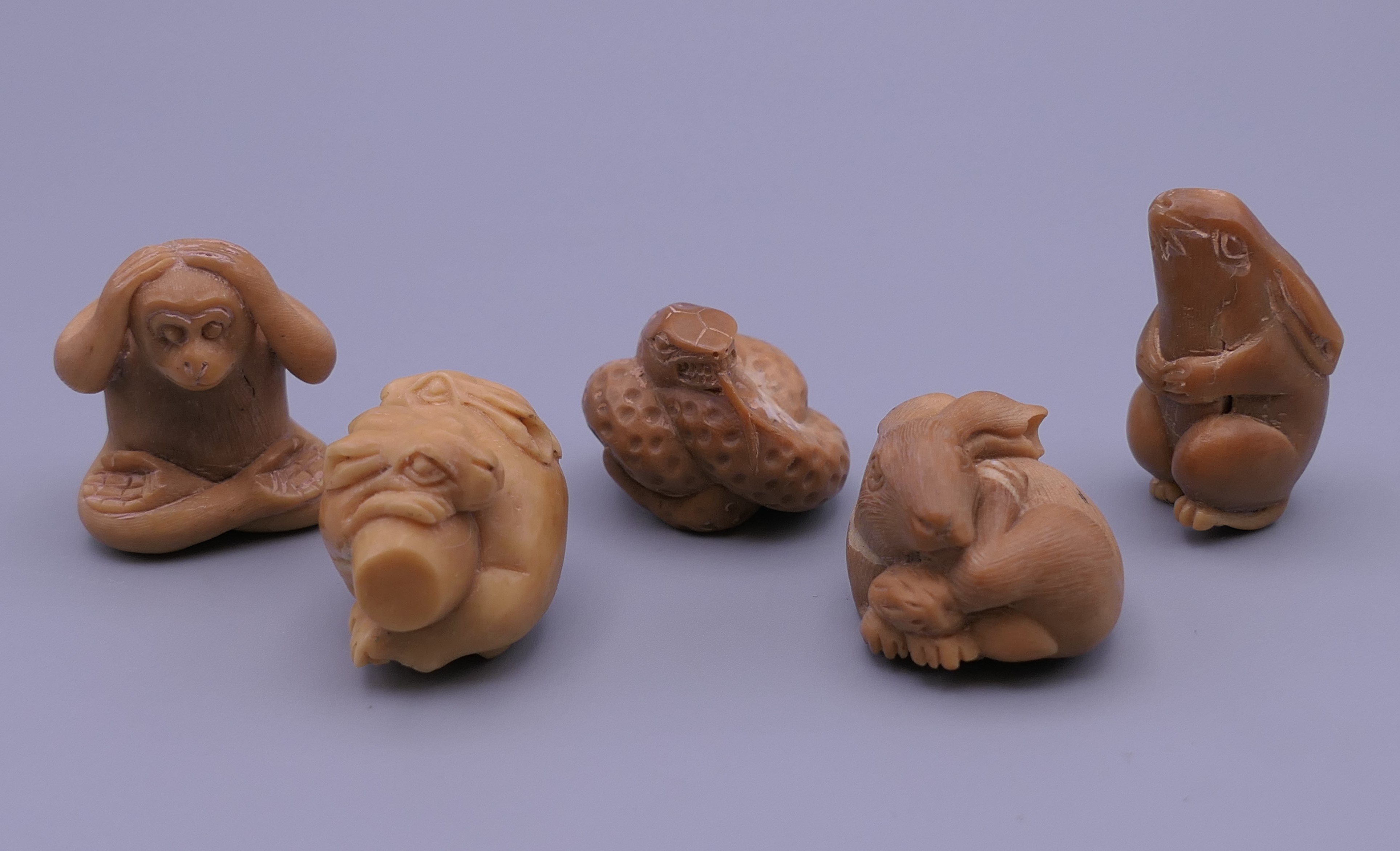 Five bone netsukes. Monkey 3.5 cm high.