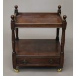 A Victorian two-tier mahogany whatnot. 51 cm wide.