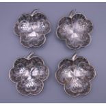 Four silver clover form dishes. Each 9.25 x 10.5 cm. 129.2 grammes.