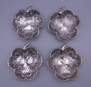 Four silver clover form dishes. Each 9.25 x 10.5 cm. 129.2 grammes.