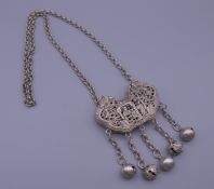 A Chinese silver pendant on chain. Pendant 6.