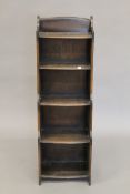 A 20th century waterfall bookcase. 115 cm high.
