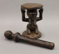 A small tribal wooden stool and a tribal fertility staff from the Congo. The former 18.5 cm high.