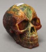 A model skull. 12 cm high.