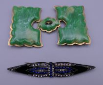 A buckle and a brooch. Brooch 9.5 cm long, buckle 5.5 cm high.