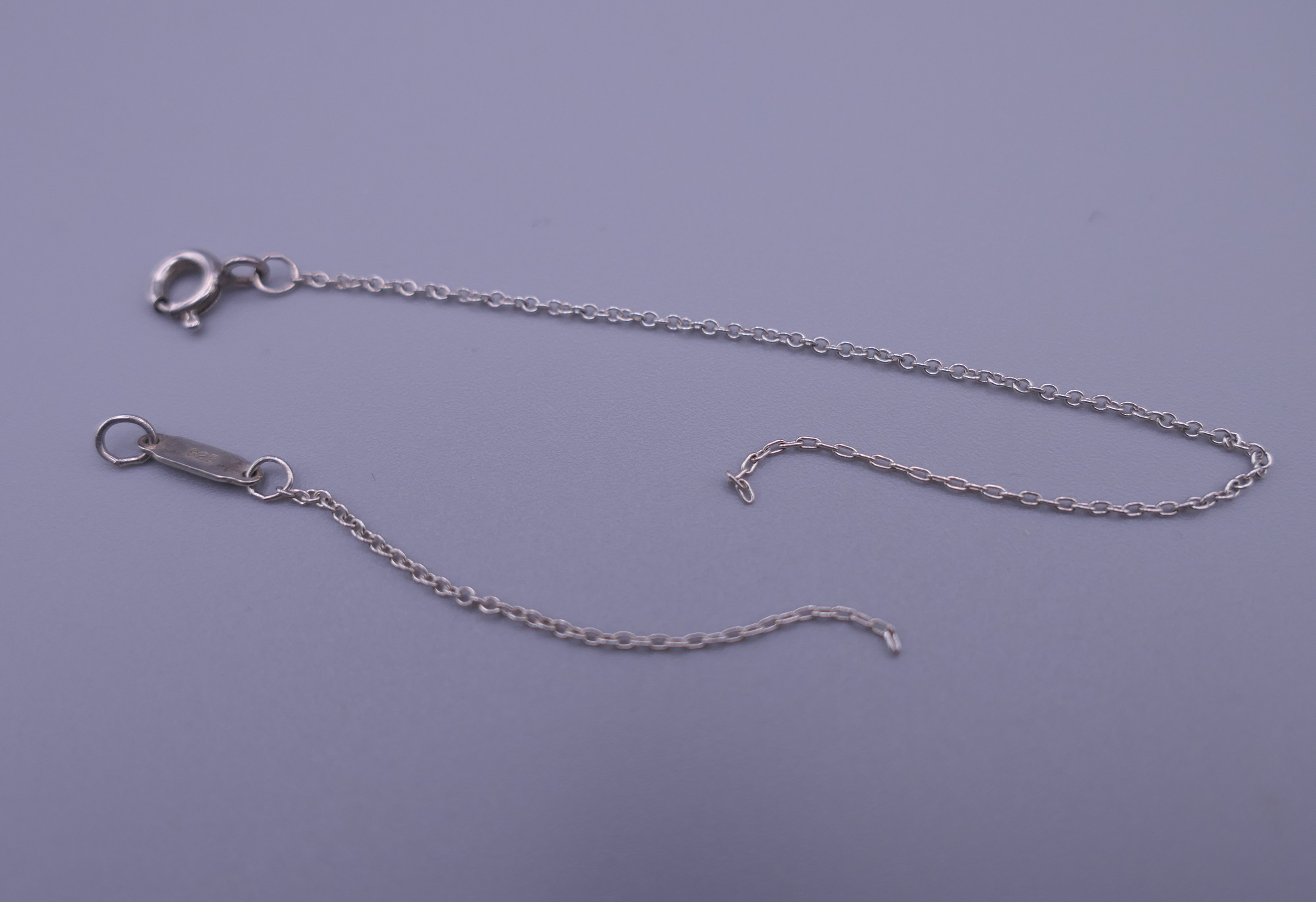 A Tiffany silver key pendant and chain, and a pair of earrings. Pendant 3 cm long. - Image 7 of 8