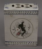 A Chinese porcelain flower brick. 14 cm high.