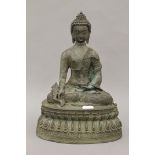 A bronze seated model of Buddha. 36 cm high.