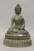 A bronze seated model of Buddha. 36 cm high.