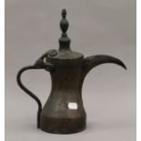 An antique Ottoman brass ewer, with an unusual incised mark. 30.5 cm high.